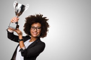 business black woman holding a cup of coffee and files